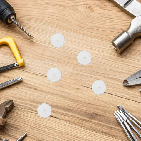 Top-Shelf Mini Plastic Gear Kit With Mechanical Project Parts Small motor components arranged on a wooden surface.