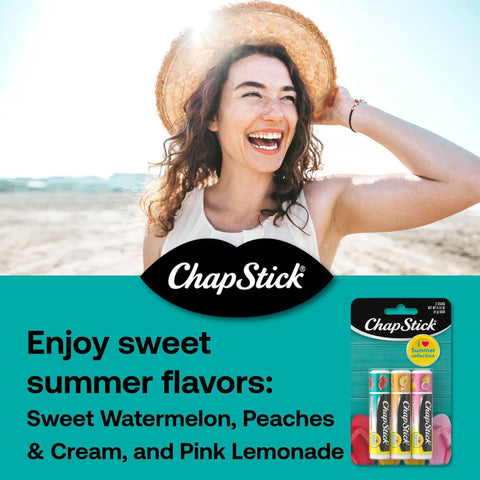 Woman with beach hat smiling, holding ChapStick Sweet Watermelon Lip Balm Trio, Peaches And Cream Lip Balm, Pink Lemonade Lip Balm, 0.15 oz, three pack.