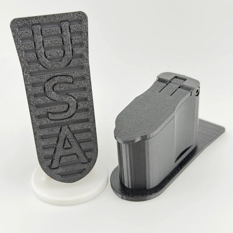 Storage Plug For SBA3 Pistol Brace With Hinged Clip In Lid, showing USA label and precision-fit design in black PETG material
