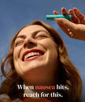 Person holding Motion And Morning Sickness Nausea Relief Inhaler No Pills Needed Fast Acting Drug Free Non Drowsy Inhaler
