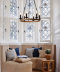 Farmhouse Wagon Wheel Chandelier With 6 Lights Industrial Round Candelabra Pendant Light Fixture in a cozy rustic nook