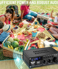 Dope Little Power Amplifier For Home Audio With 2 Channel Bluetooth 300W Max Output shown at a picnic with food and people.