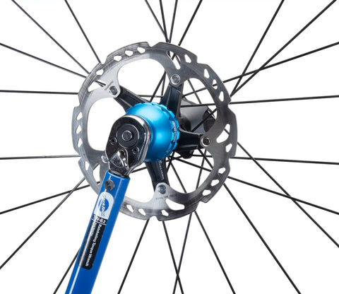 Blue Anodized Bottom Bracket And Pedal Tool With Laser Engraving in use on bicycle disc brake