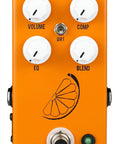 Front view of Pulp N' Peel V4 Compressor Guitar Effects Pedal with four control knobs, added EQ, dirt toggle, orange casing.