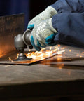 Worker using Roloc Non-Woven Surface Conditioning Disc 2 Inch Open-Web Abrasive for deburring metal sheet, quick-change backing.