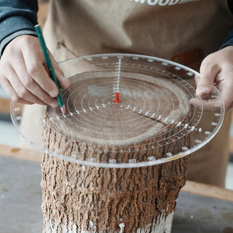 Person using Clear Acrylic Center Finder Gauge For Circles 11.8 Inch Diameter Lathe Centering Tool on a wooden log