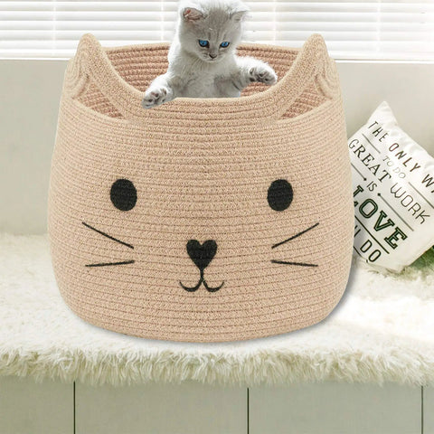 Kitten sitting in a large cotton rope storage basket with cozy cat face design for towels, blankets, toys, and clothes, 15x14 inches