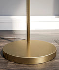Brass Finish USB Floor Lamp With Built In Tray And USB Port base detail on wood floor showing circular design in modern style