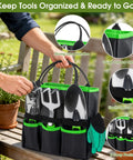 Person holding 10 Piece Garden Tool Set With Heavy Duty Storage Tote Workhorse Includes Pruner Trowel Transplanter Hand Rake Weeder Cultivator Repot Mat Gloves Plant Tags And Carrying Case Rust Resistant Tools With Non Slip Ergonomic Handles For Women And Men Green on a bench.