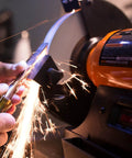 Eight Inch Bench Grinder Powered By A Beefy Four Point Eight Amp Motor Hitting 3450 RPM in action sharpening a knife.