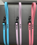 Top Tier Hella Sturdy Black Swivel Eye Bolt Snap Hooks And Heavy Duty Dog Leash Clips With Rust Resistant Zinc Alloy Build For Secure Pet Walking Gear Four Pack featuring colorful leashes in blue, pink, and purple.