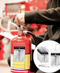 Person inspecting fire extinguisher with 25 Pack Fire Extinguisher Inspection Tags With Waterproof Plastic Covers, Durable Aluminum Metal Tags, Resealable Iron Wire Tamper Seals, Indoor Outdoor Service Record Tags For Easy Fire Safety Compliance.