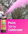 Woman using a Pink Gender Reveal Smoke Cannon Party Prop Powder Spray Can outdoors, creating pink smoke for celebration.