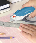 Person using a utility knife with a Ten Pack Utility Knife Blades Refills For Box Cutters, Heavy Duty SK5 High Carbon Steel Razor Blades.