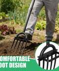 Heavy Duty 5 Tine Garden Fork With D Grip Handle 69 Inch Spading Fork in use for loosening soil, person demonstrating ergonomic grip
