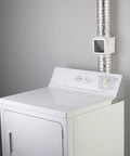 White dryer with No Brainer Extra Heat Dryer Saver for 4 inch ducts, installed with plastic clamps for moisture control and energy saving.