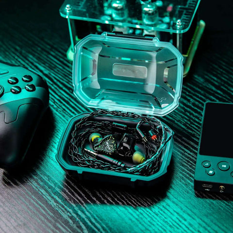 Slick Waterproof Iem Case And Portable Earbud Hard Shell Road Ready Box For In Ear Monitors Plus Cable Organizer with earbuds inside.