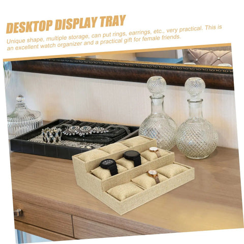 Multi Grid Watch Organizer With Deep Compartments For Desktop And Home, Classic Jewelry Display Tray With Soft Cushion Pads on wooden dresser.