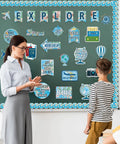Teacher and student with Travel The Map Bulletin Board Set For Classroom Decor With World Map Borders Adventure Cutouts