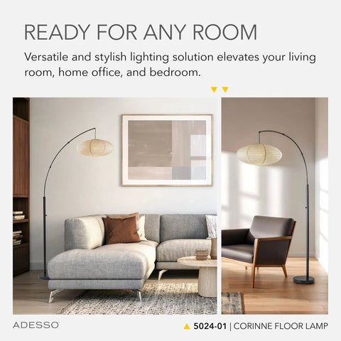 Arc Floor Lamp With 80 Inch Reach, Black Base, Oval Off White Paper Shade in living room setting with sofa and chair.