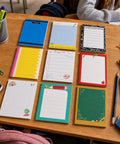 Nine Styles Sticky Notes Set For Teachers Back To School Gift With 450 Sheets Total 50 Sheets Each on a classroom desk.