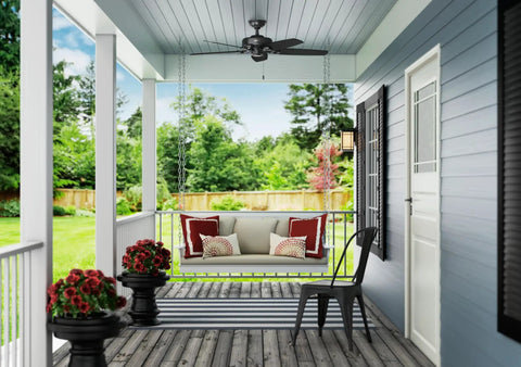 52 Inch Matte Black Ceiling Fan With Pull Chain No Light Damp Rated For Indoor Outdoor Use on a porch ceiling with garden view.
