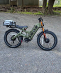 2025 Dual Motor Electric Bike For Adults 46 Mph Peak Speed 52V 70Ah Battery, green frame, 26 inch tires, full suspension design.