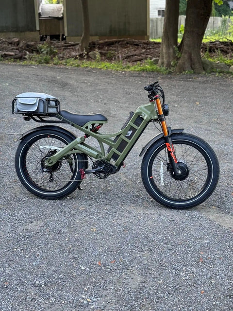 2025 Dual Motor Electric Bike For Adults 46 Mph Peak Speed 52V 70Ah Battery, green frame, 26 inch tires, full suspension design.