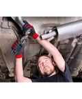Mechanic using wrench wearing nitrile coated work gloves, size large, oil and grease resistant, with tight grip, under car