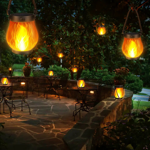 2 Pack Gen2 Solar Lantern Lights With USB C Ultra Real Flame Warm White illuminating outdoor patio at night