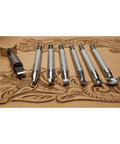 Level Up Your Leather Crafting Game With This Sweet Beginner Tooling Kit Featuring A Sharp Swivel Knife Six Essential Stamps Veg Tan Patterns And A Nifty Instructional Booklet For Dope Custom Designs, showcasing chrome plated stamps on leather.