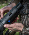 Person holding DTI Six Twenty Thermal Imaging Camera High Resolution Monocular for Night Hunting, close-up view.