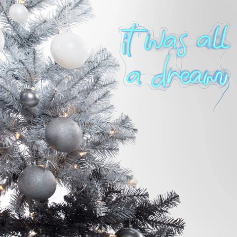 Blue USB Neon Sign for Wall Decor It Was All a Dream LED Neon Light next to decorated winter tree with gray ornaments
