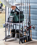 Garage Fishing Pole Organizer That Holds Ten Rods, Reels, Tackle Box, And Gear With Built In Shelves, on a wooden deck.