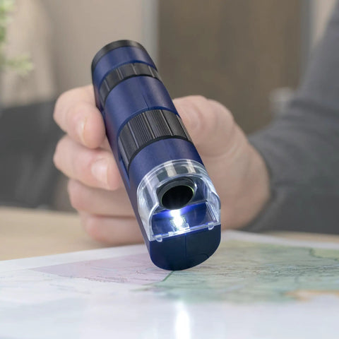 Pocket Microscope With LED 20x To 60x Magnification, Handheld STEM Toy For Curious Kids And Adults, Easy To Use For Exploring Insects, Leaves, Textures, And Everyday Science Adventures in blue plastic, shown in hand