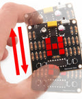 Electronic Dice Soldering Kit For Beginners And Students DIY LED Dice Circuit shown in hand with visible components