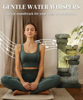 Woman meditating beside Four Tier Outdoor Water Fountain With LED Lights, 33.5 Inch Tall Resin Cascading Bowls Waterfall for Garden