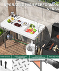 42.5 Inch Folding Fish Cleaning Table With Sink And Hose Hookup Portable Outdoor Fishing Station next to barbecue grill