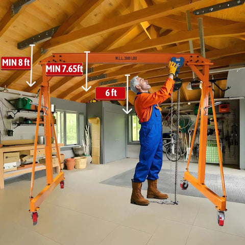 Adjustable Gantry Crane With Trolley And Hoist Heavy Duty 2000 Lbs Capacity Height Range 7.65 To 10.91 Ft 8.5 Ft Wide Shop Garage Crane With Rigging Kit Portable Steel Gantry For Home Workshop And DIY Projects set up in workshop with person adjusting hoist