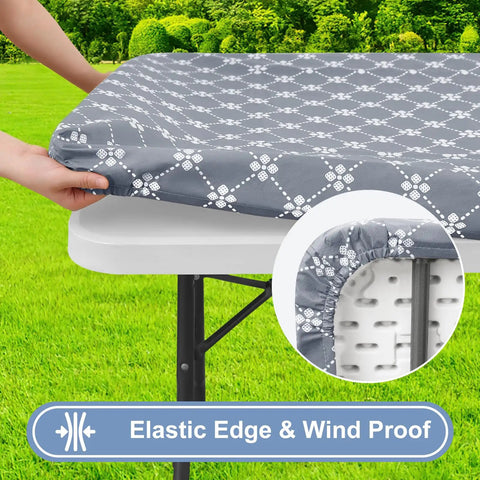 Rectangular Vinyl Table Cloth With Elastic Fitted Edges And Flannel Backing, Waterproof And Stain Resistant Cover That Stays Put On 6 Foot Folding Tables For Picnics Camping Indoor Or Outdoor Use Gray 30 By 72 Inches shown on a table outdoors.