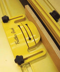 Heavy Duty Safety Feather Guards Pair For Table Saw Router Table Woodworking Jig knobs aligning a workpiece on a yellow surface.