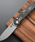 Folding Knife With 14C28N Steel Blade And Carbon Fiber Handle Go To EDC Knife With Pocket Clip, displayed on a wooden board