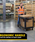 Worker using Two Shelf Foam Utility Cart With Lipped Shelves And Ergonomic Handle Black 500 Lb Capacity Durable Rolling Cart in warehouse