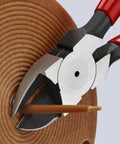Close-up of Pro Grade Flush Cut Diagonal Cutters Set 2-Piece cutting wire with precision. Vanadium steel jaws with spring.