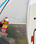 Hella Tough Rubber Sealant Spray Coating That Patches Roof Leaks Quick And Lays Down Flexible Waterproof Armor For Easy Whole House And Garage Fixes In A Six Pack Bundle being applied to a metal surface.