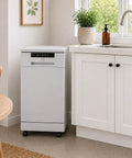 18-Inch Energy Star Portable Dishwasher In White in a modern kitchen corner with houseplants and a stylish design.