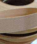 Close-up of premium Red Oak Edge Banding Tape Thirteen Sixteenths Inch 250 Foot Roll Pre Glued Iron On Veneer shown in a smooth sanded finish.