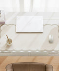 Stylish Scallop Edge Desk Mat Crafted From Smooth Faux Leather Blend With No Sweat Cleanup Perfectly Sized For Big Screens And Heavy Keyboards on a work desk.