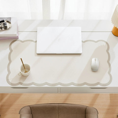Stylish Scallop Edge Desk Mat Crafted From Smooth Faux Leather Blend With No Sweat Cleanup Perfectly Sized For Big Screens And Heavy Keyboards on a work desk.