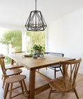 Juliet 1-Light Industrial Chandelier In Matte Black With Open Socket Design And Hanging Chain in dining room setting